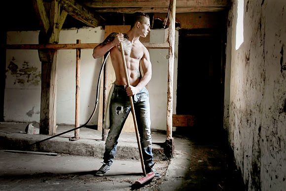 sweeping barn boy